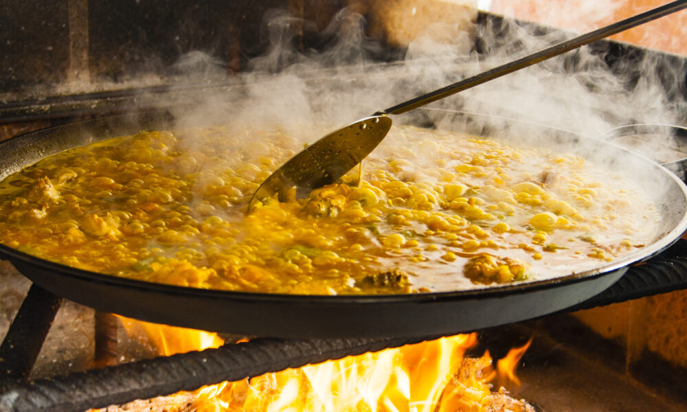Paella, cooking over a fire